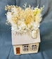 House planter with dried flowers